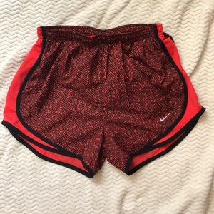 Red and black nike shorts